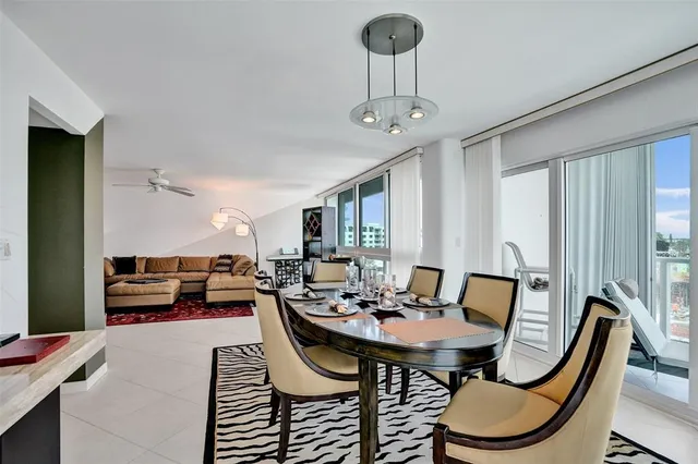 a kitchen with a stove a sink and white cabinets