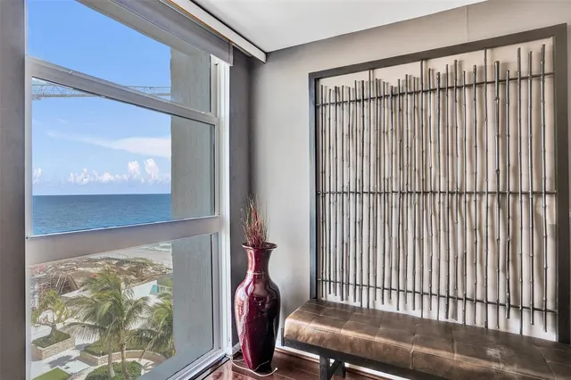 a bed room with a bed window and a television