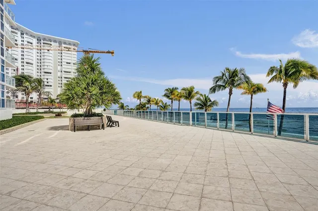 a room with pool table and windows