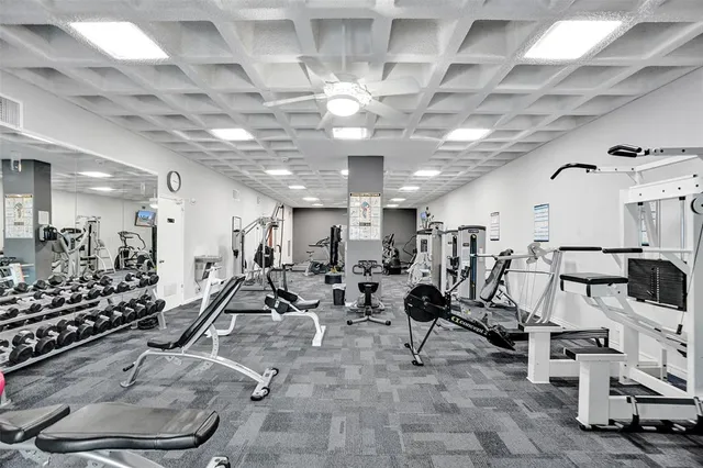 a living room with furniture a table and chairs