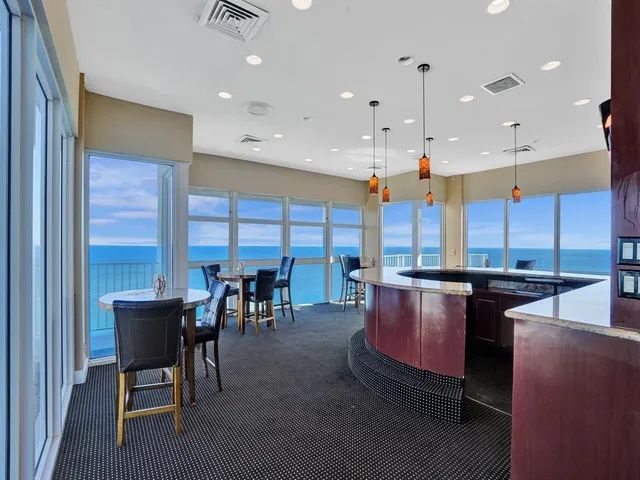 a large kitchen with a table and chairs