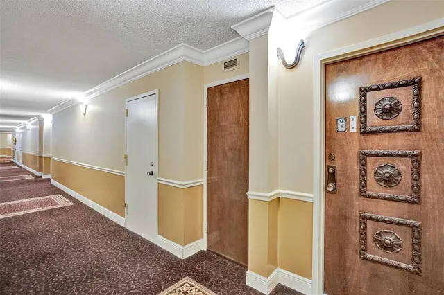 a living room with furniture a rug and a large window