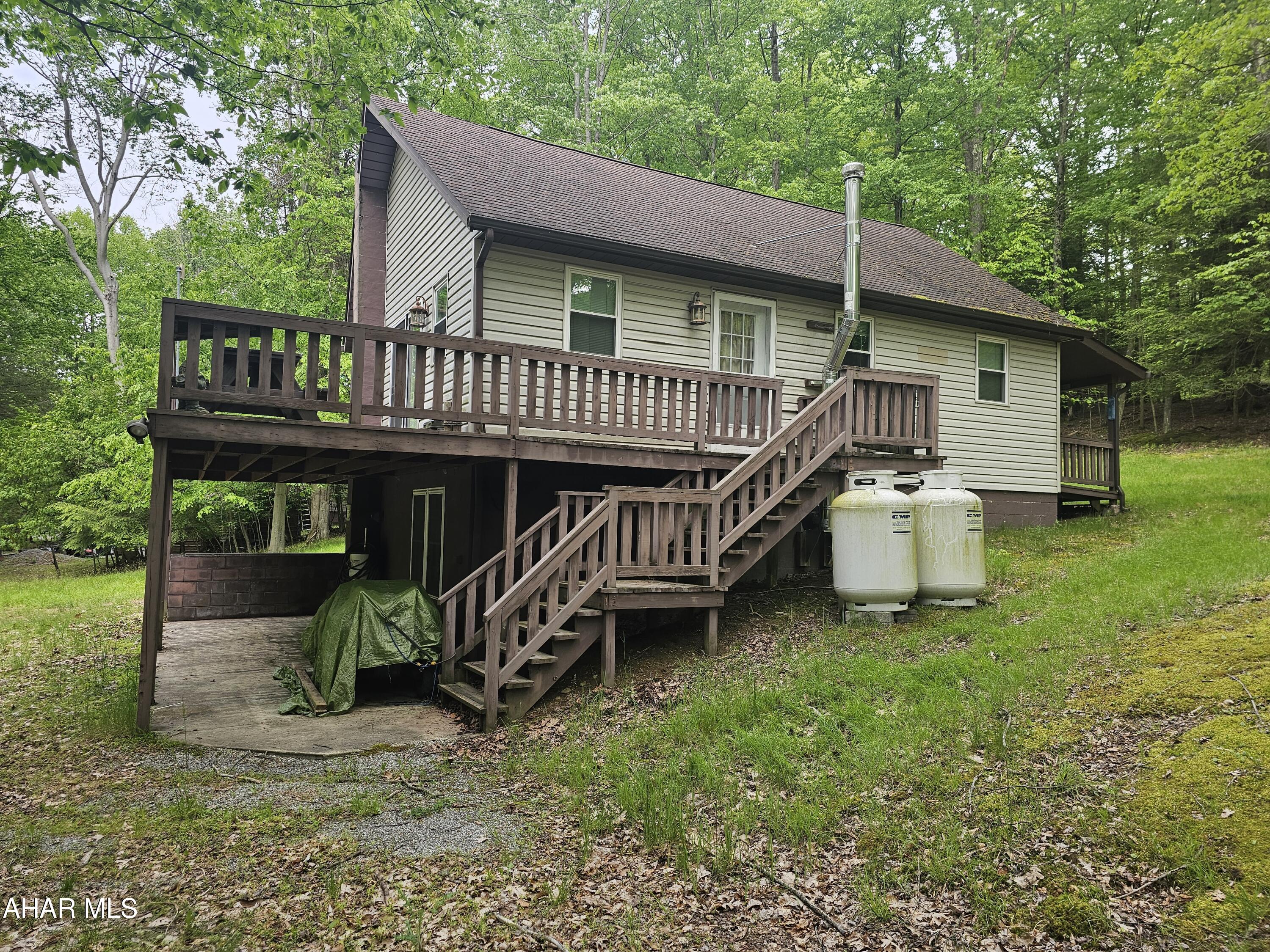207 Kendrick Lane Flinton, PA 16640 - Photo 2 of 30 a view of a house with a yard deck and furniture