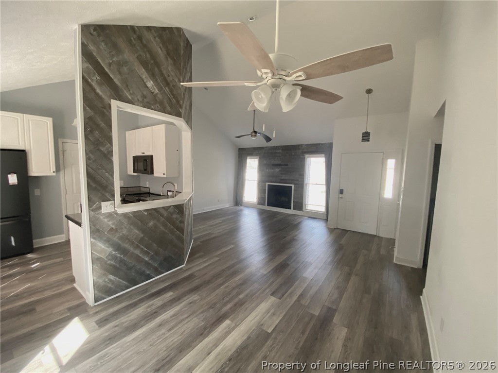 5715 Walkabout Road Hope Mills, NC 28348 - Photo 11 of 16 a view of main area wooden floor an entryway and fire place