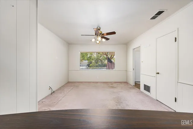 a view of a kitchen with granite countertop stainless steel appliances a sink and cabinets