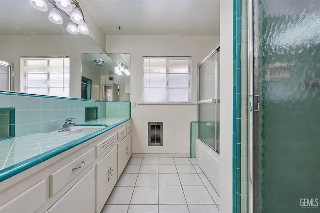 a view of storage and utility room with closet