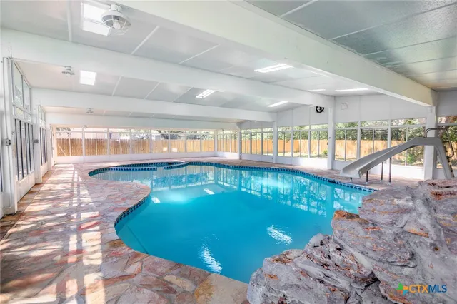 a view of a swimming pool and outdoor space