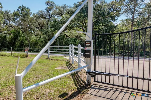 a view of balcony with wooden floor and fence