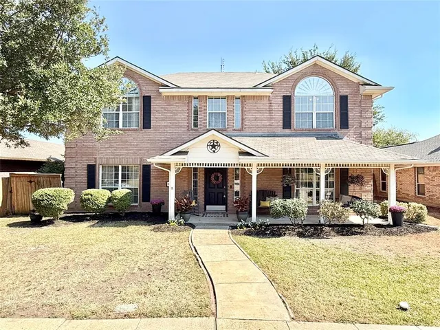 a front view of a house with a patio