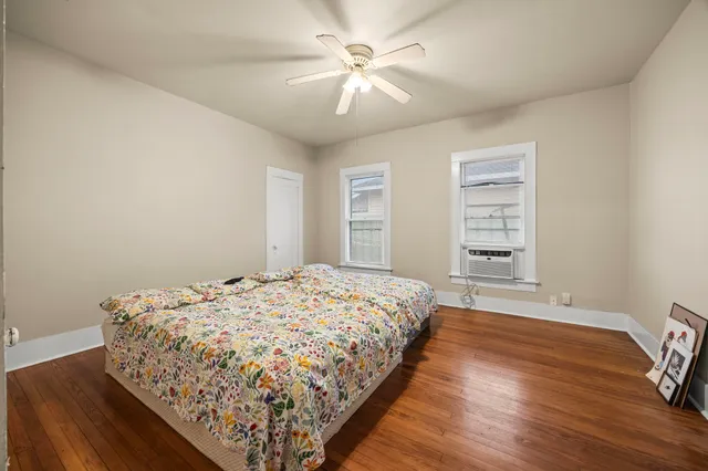 a bedroom with bed and a window