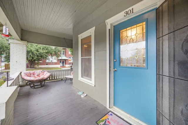 a room with wooden floor and furniture