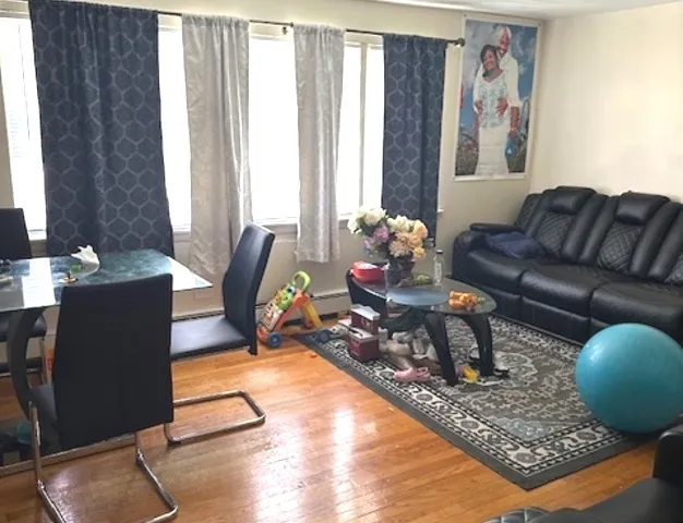 a living room with furniture and a window