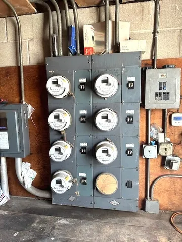a room with kitchen island a sink a stove and a refrigerator