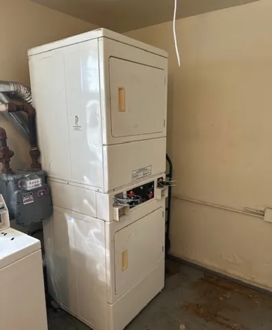 a close up of a storage and utility room with washer and dryer