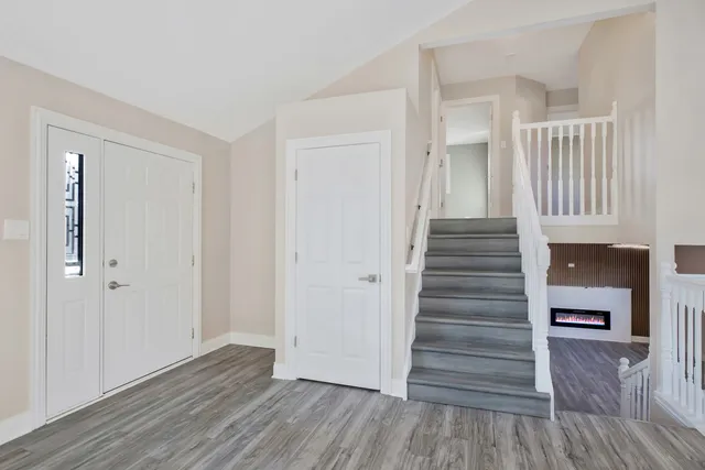 a view of entryway with wooden floor