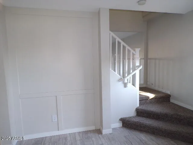 a view of entryway with wooden floor