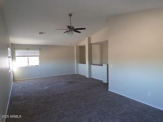 a view of empty room with windows