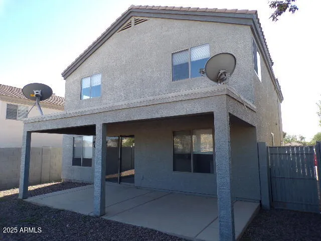 a front view of a house with parking space