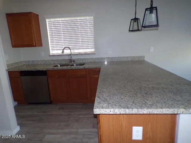 a kitchen with granite countertop a sink and a granite counter tops