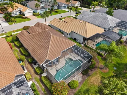 an aerial view of a house with a lake view