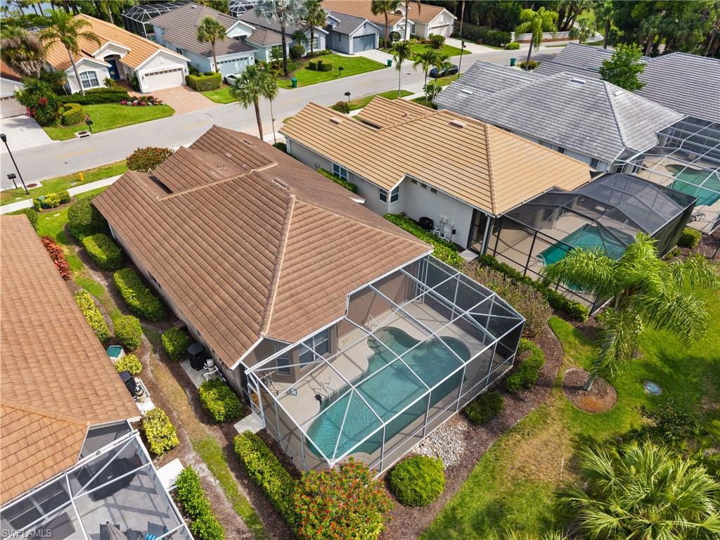 1717 Winding Oaks Way Naples, FL 34109 - Photo 28 of 29 an aerial view of a house with a garden