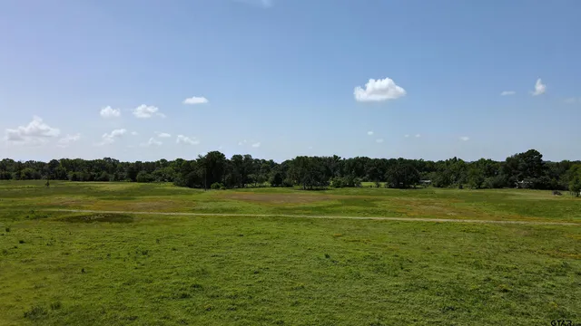 a view of an ocean beach and mountain