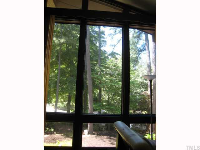 4612 Fernham Place Raleigh, NC 27612 - Photo 5 of 8 a view of a porch with a floor to ceiling window