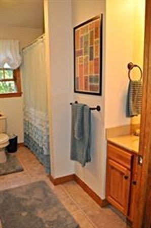 272 Old Hardwick Road Barre, MA 01005 - Photo 18 of 30 a bathroom with a granite countertop sink and a mirror