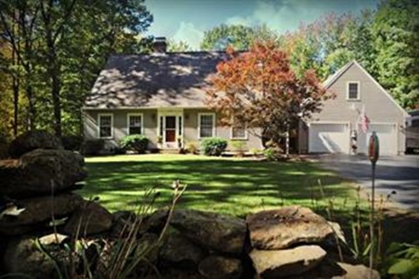 272 Old Hardwick Road Barre, MA 01005 - Photo 2 of 30 a front view of a house with a garden