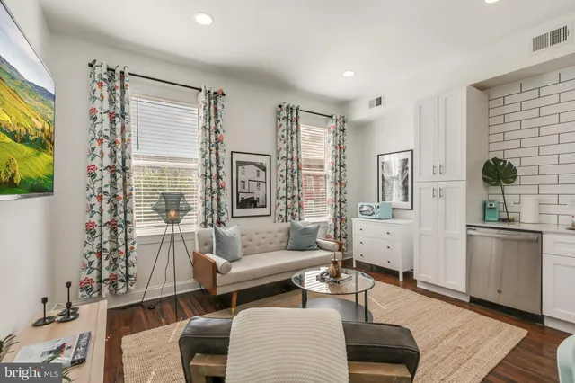a living room with furniture and a window