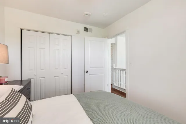 a bedroom with a bed and a shower