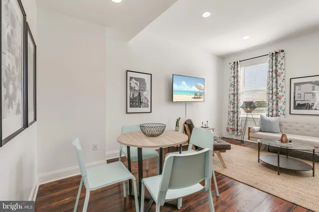 a dining room with furniture and window