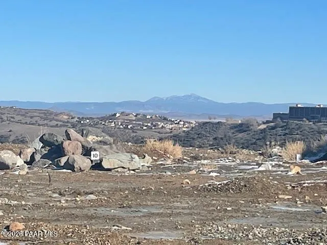 a front view of a house with a sign board