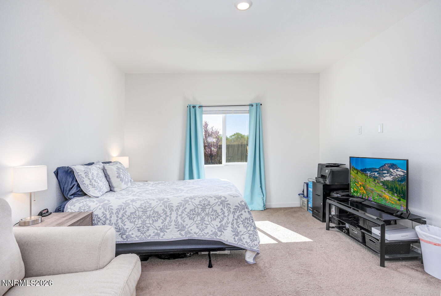1135 Tamarack Drive Fallon, NV 89406 - Photo 12 of 23 a bedroom with furniture and a flat screen tv