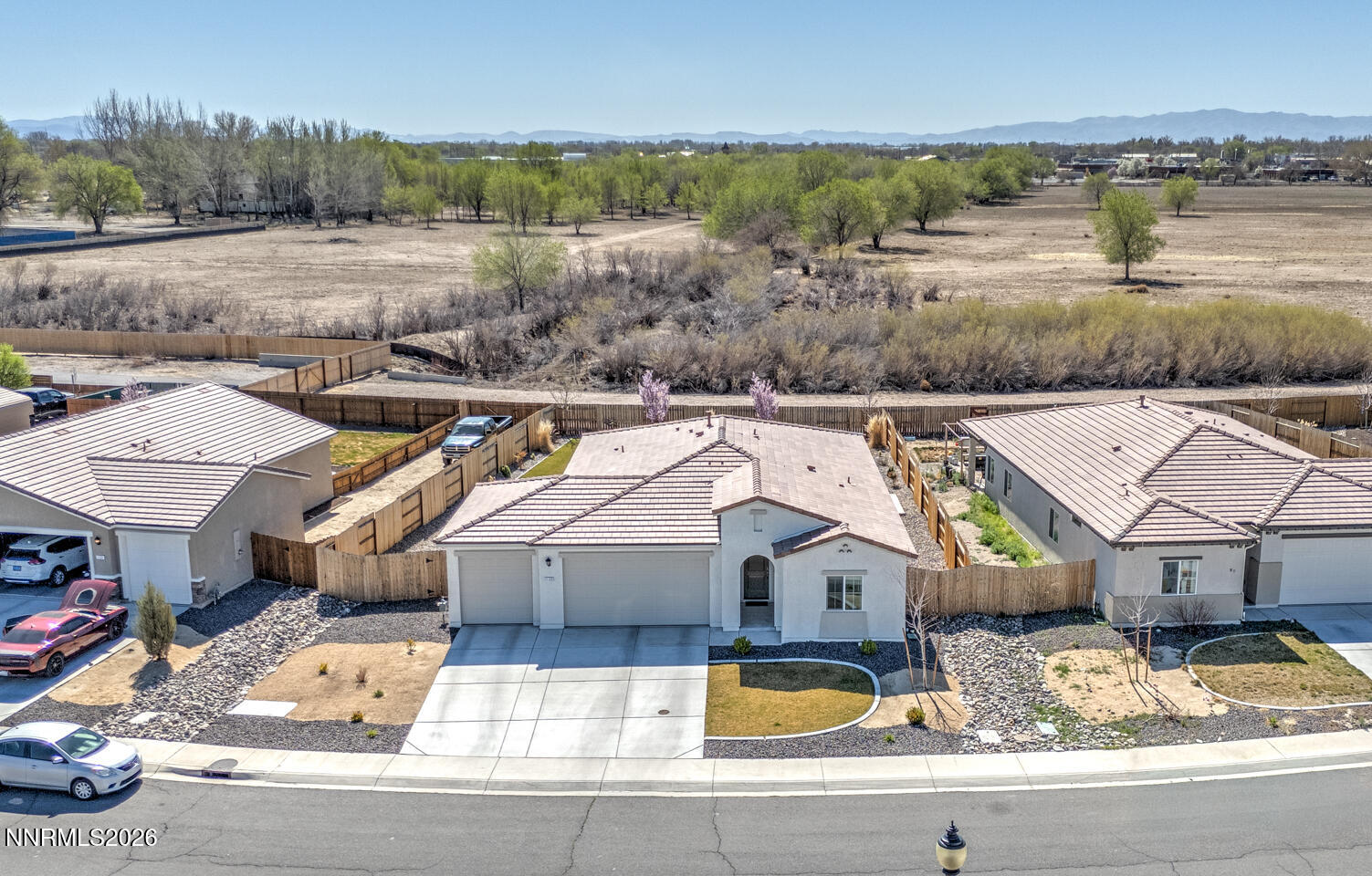 1135 Tamarack Drive Fallon, NV 89406 - Photo 2 of 23 an aerial view of a house with a lake view