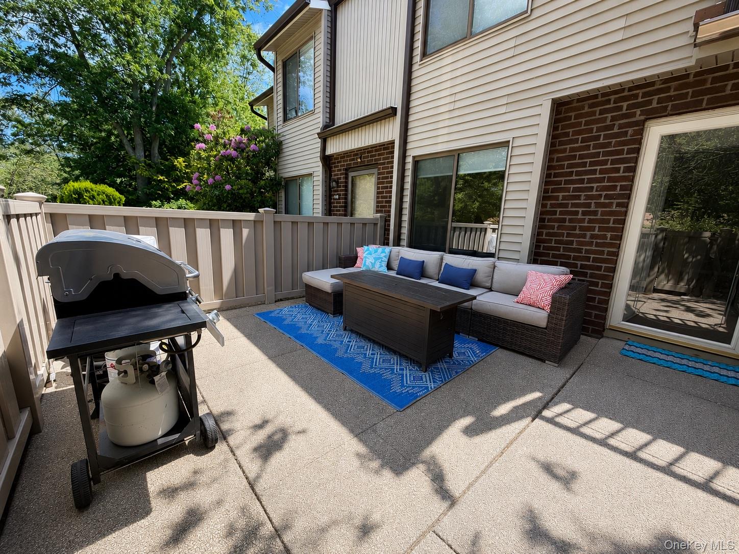 201 Birchwood Road, Unit 201 Coram, NY 11727 - Photo 2 of 27 a view of a roof deck with furniture