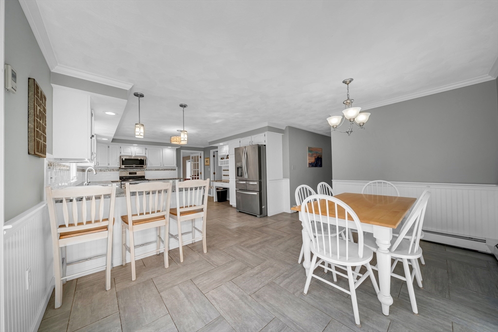 315 Candlestick Road North Andover, MA 01845 - Photo 11 of 42 a dining room with furniture and chandelier