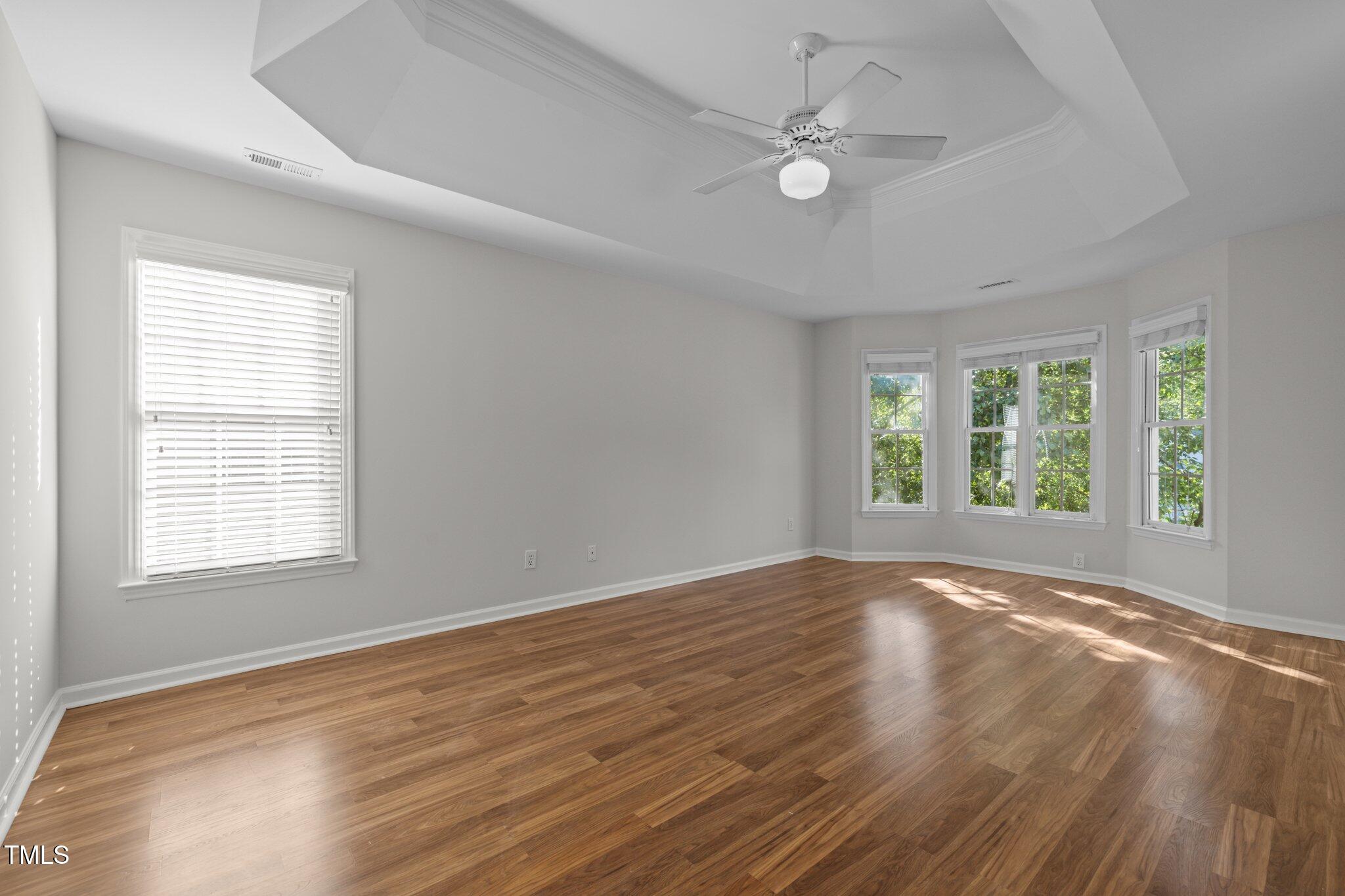 2309 Clerestory Place Raleigh, NC 27615 - Photo 18 of 37 a view of an empty room with wooden floor and a window
