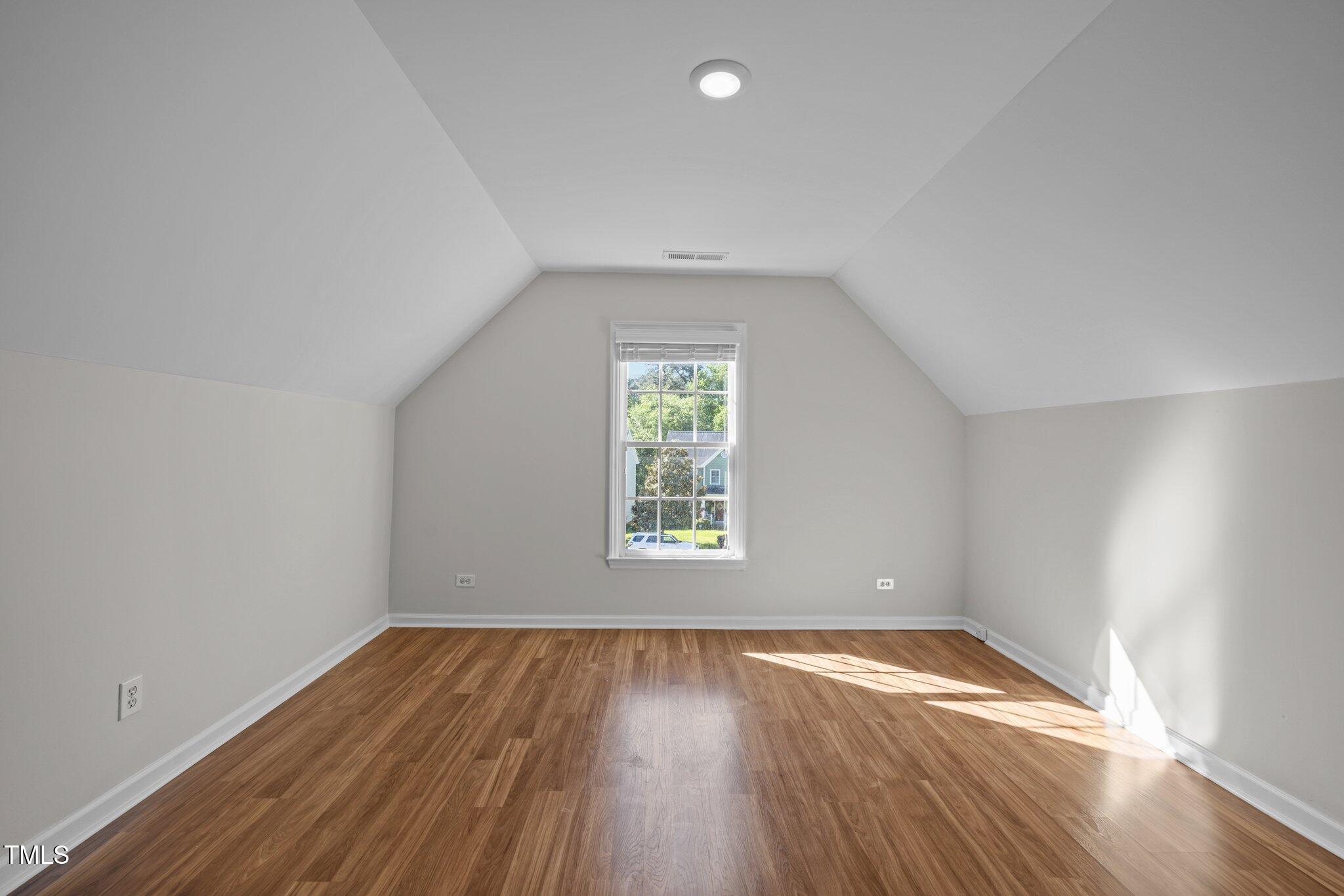 2309 Clerestory Place Raleigh, NC 27615 - Photo 26 of 37 an empty room with wooden floor and windows