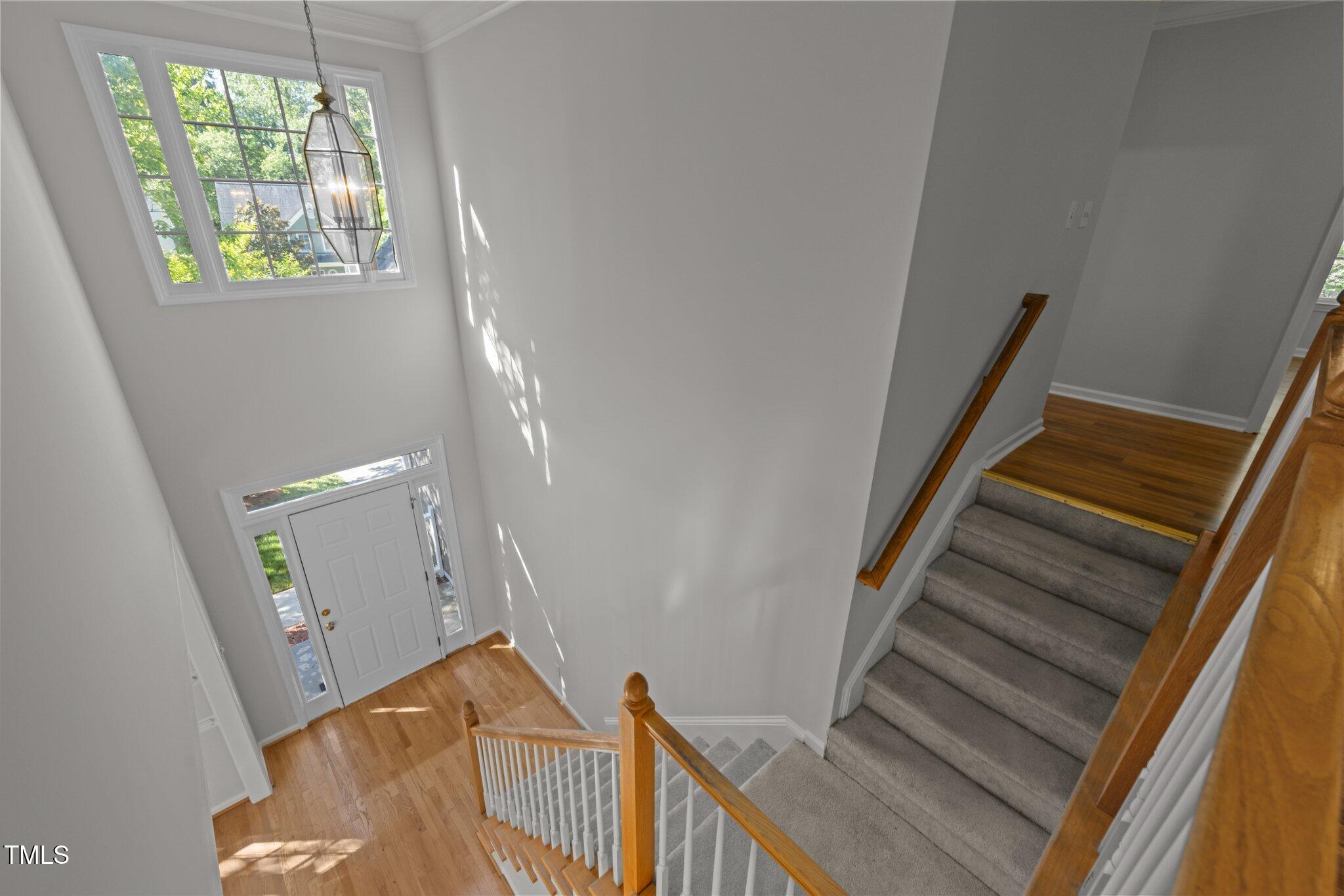 2309 Clerestory Place Raleigh, NC 27615 - Photo 30 of 37 a view of entryway and hall with wooden floor