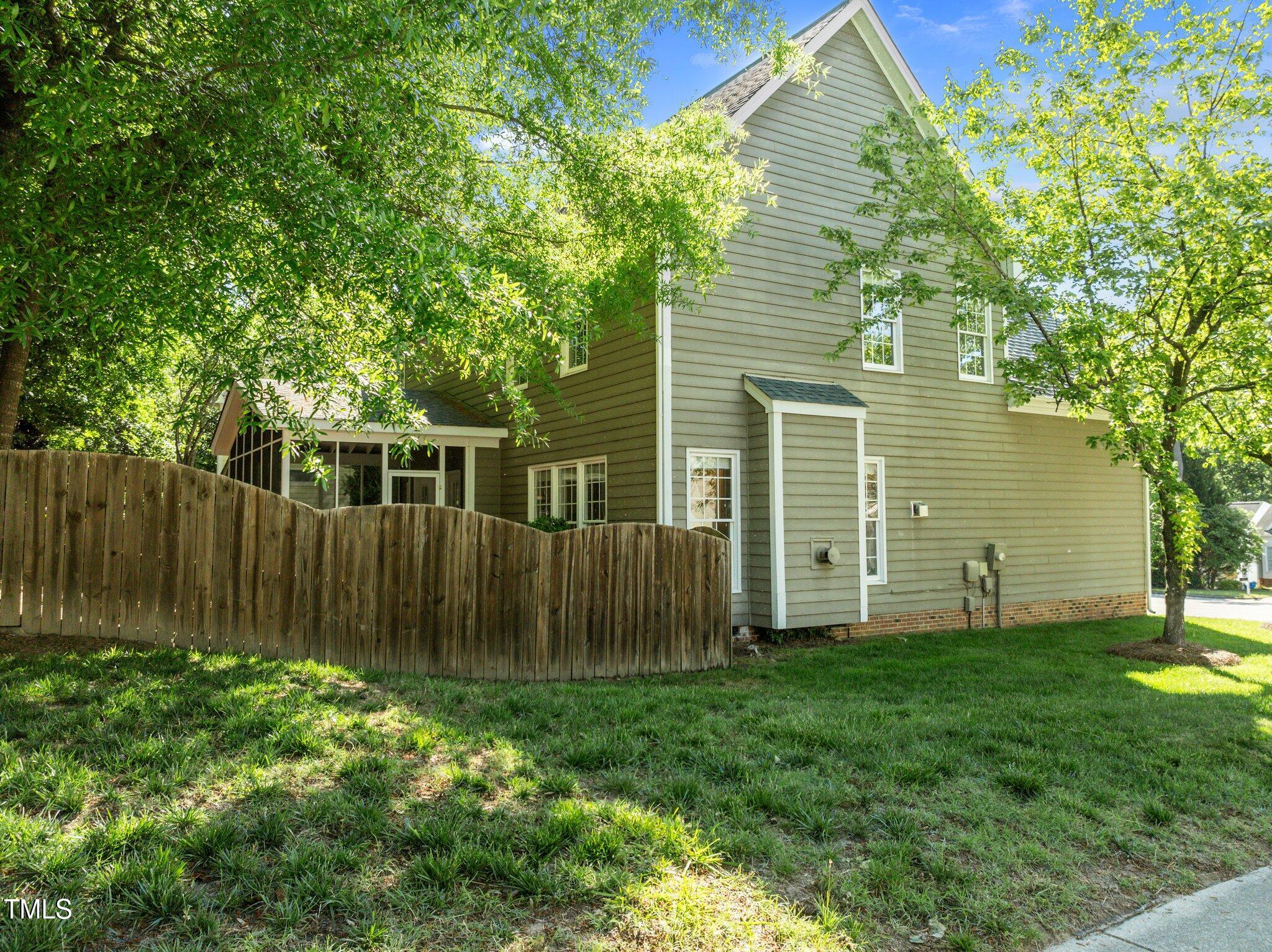 2309 Clerestory Place Raleigh, NC 27615 - Photo 36 of 37 a view of a backyard with plants and large trees