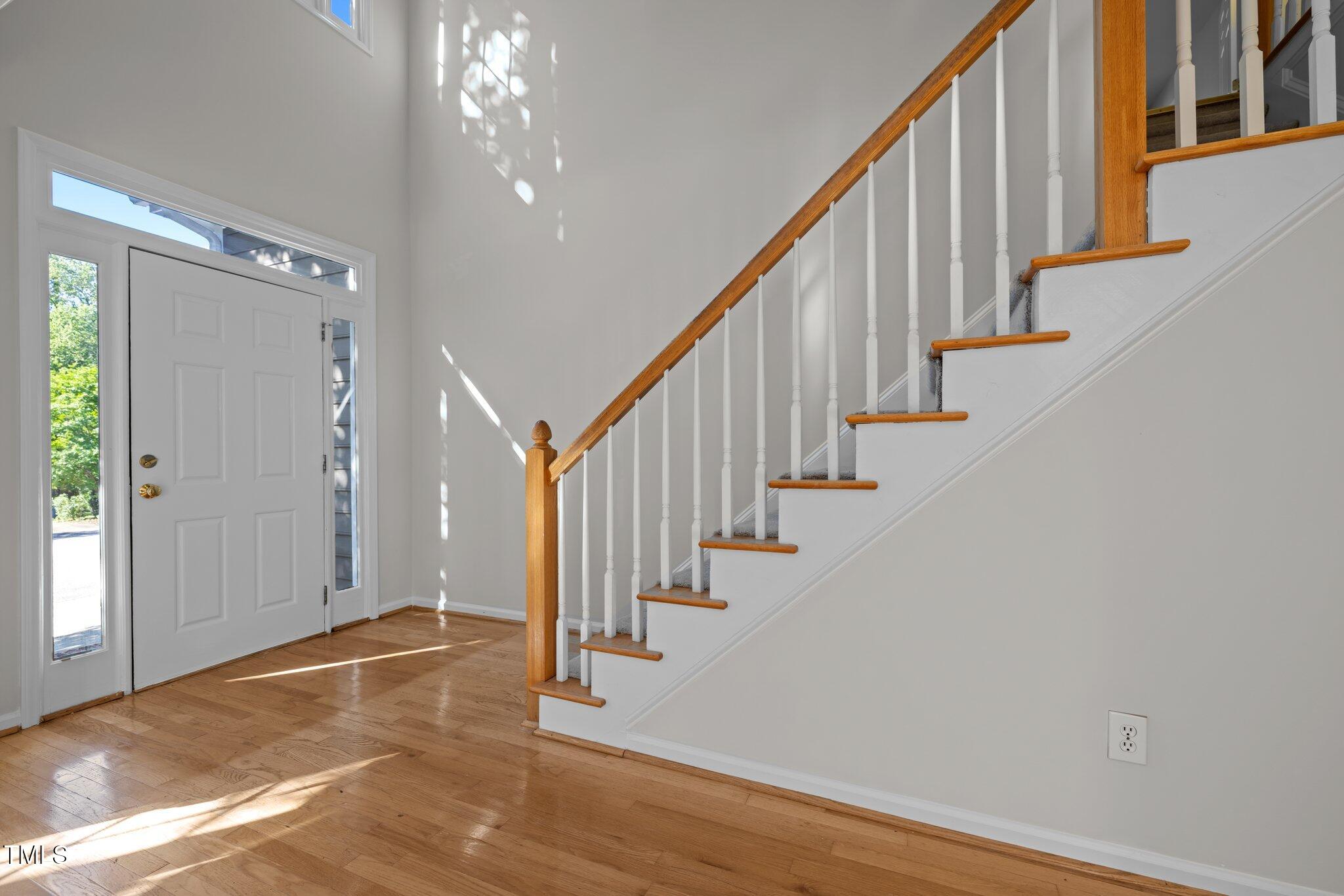 2309 Clerestory Place Raleigh, NC 27615 - Photo 6 of 37 a view of an entryway with wooden floor