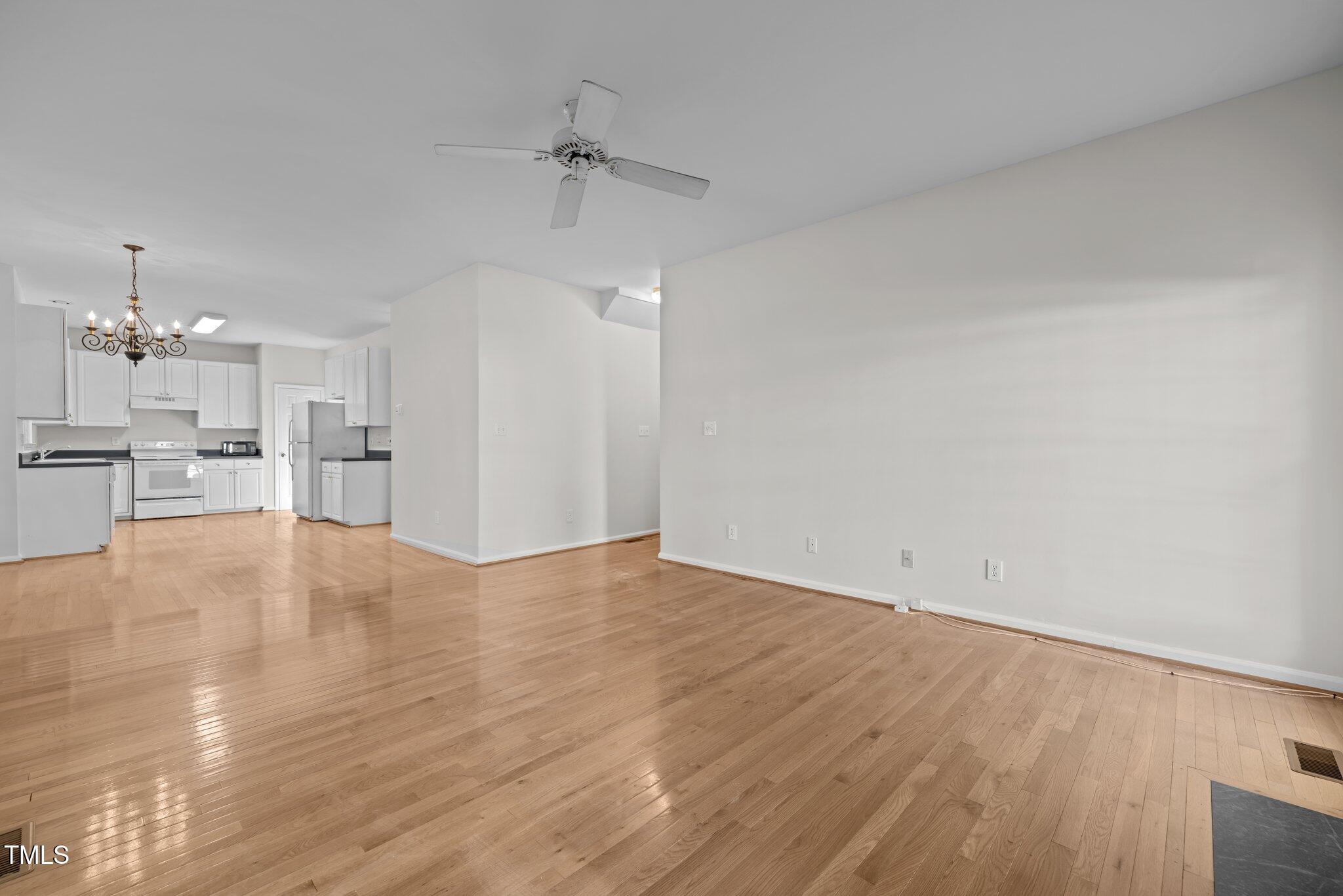 2309 Clerestory Place Raleigh, NC 27615 - Photo 10 of 37 a view of a kitchen with wooden floor and a kitchen