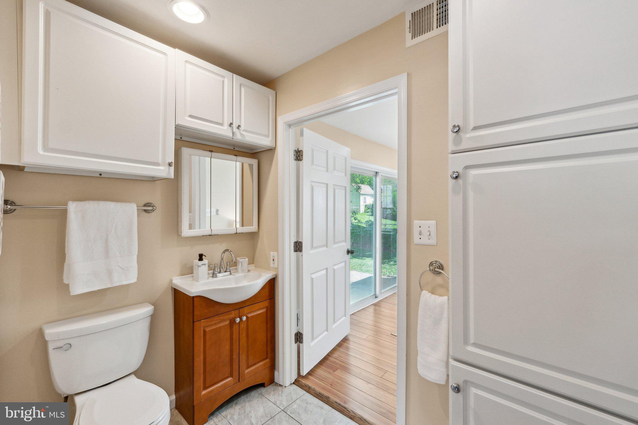 2621 Terrapin Road Silver Spring, MD 20906 - Photo 16 of 26 a spacious bathroom with a sink a toilet and shower