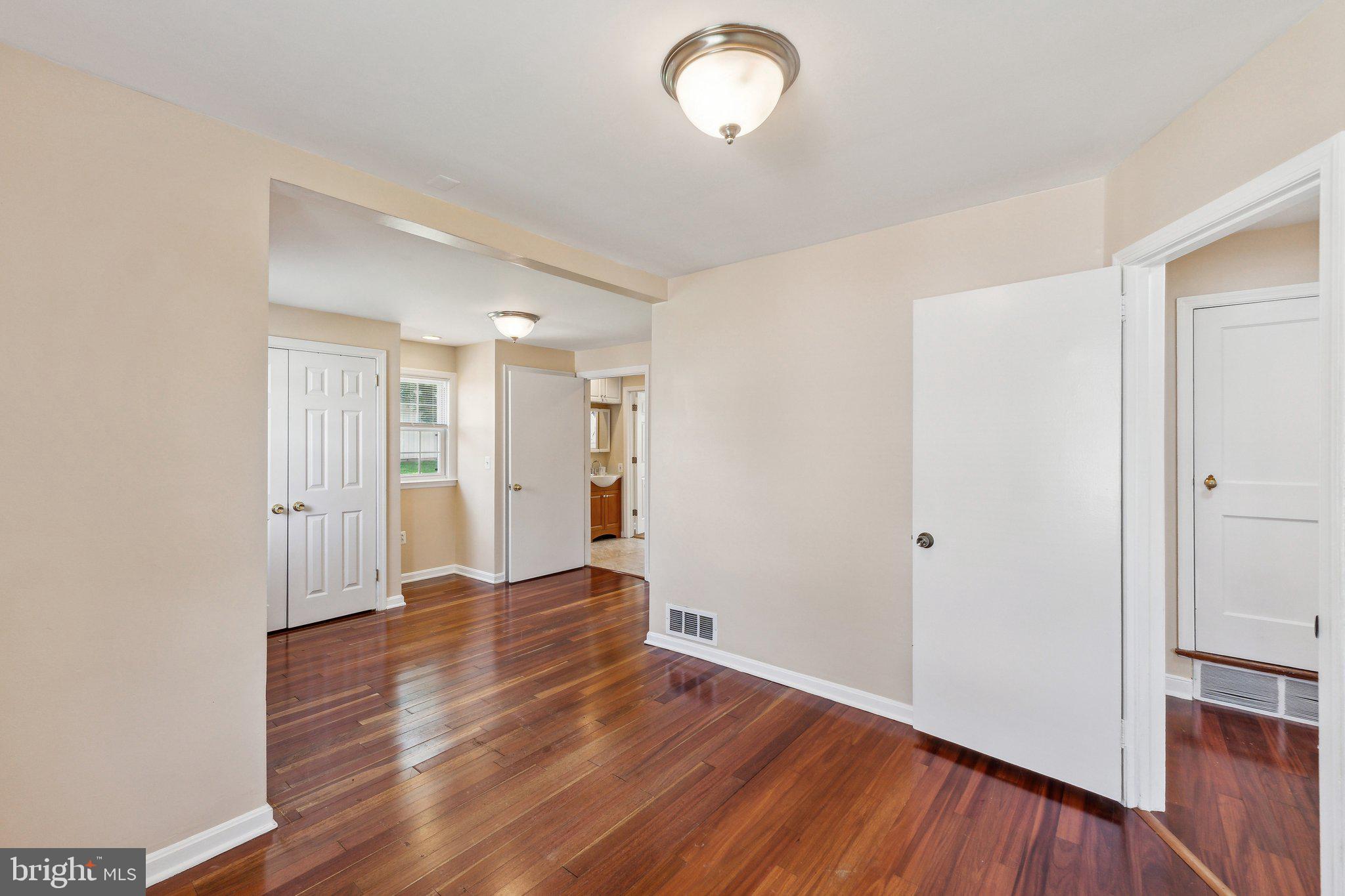 2621 Terrapin Road Silver Spring, MD 20906 - Photo 22 of 26 a view of empty room with wooden floor