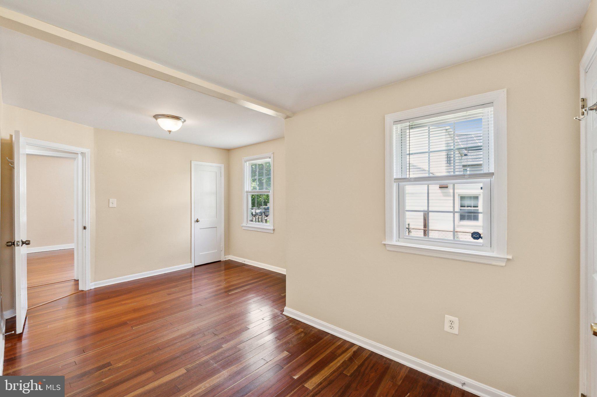 2621 Terrapin Road Silver Spring, MD 20906 - Photo 23 of 26 a view of an empty room with wooden floor and a window