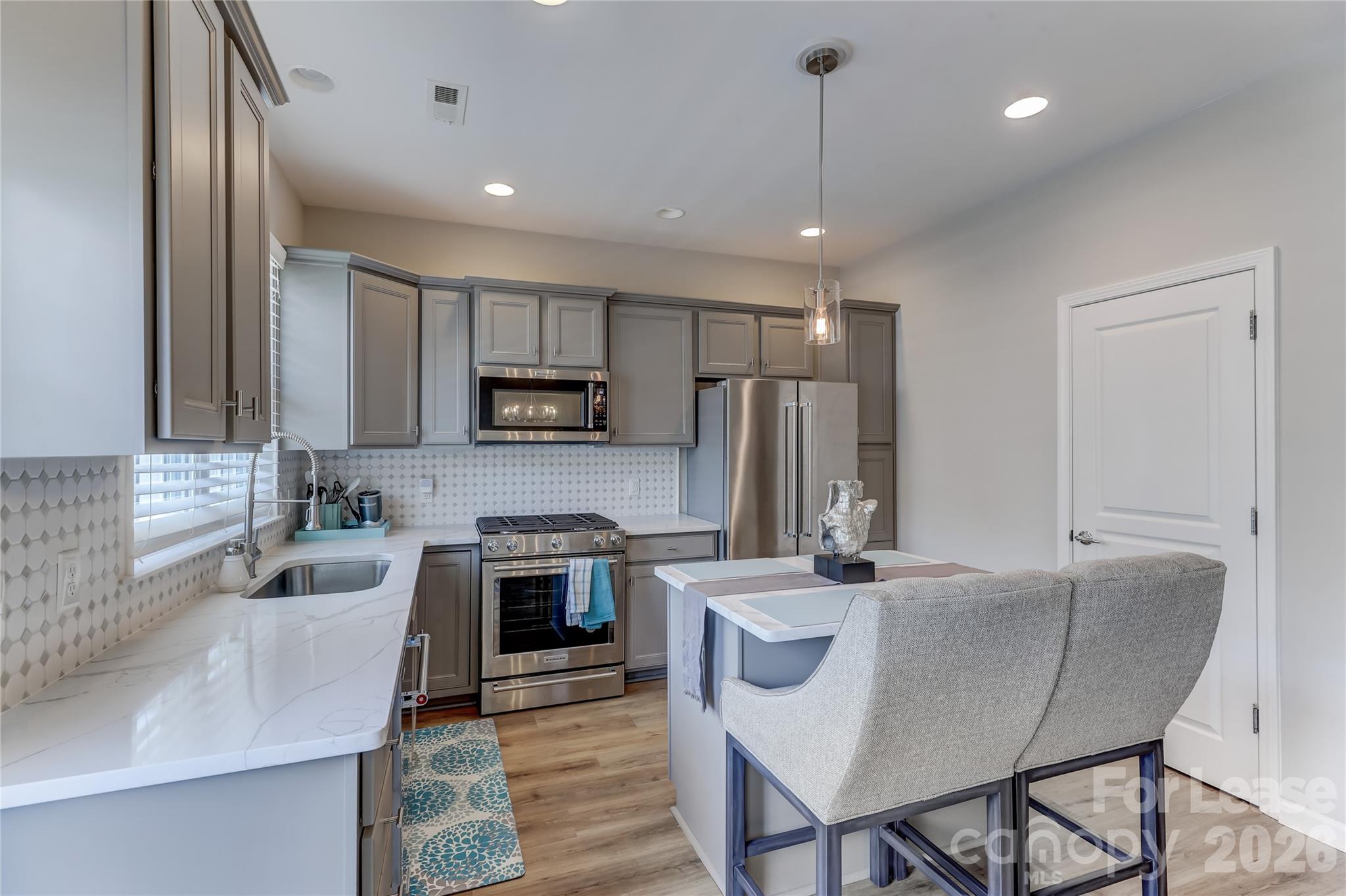 905 Lyndley Drive Fort Mill, SC 29708 - Photo 14 of 42 a kitchen that has a sink cabinets and stainless steel appliances