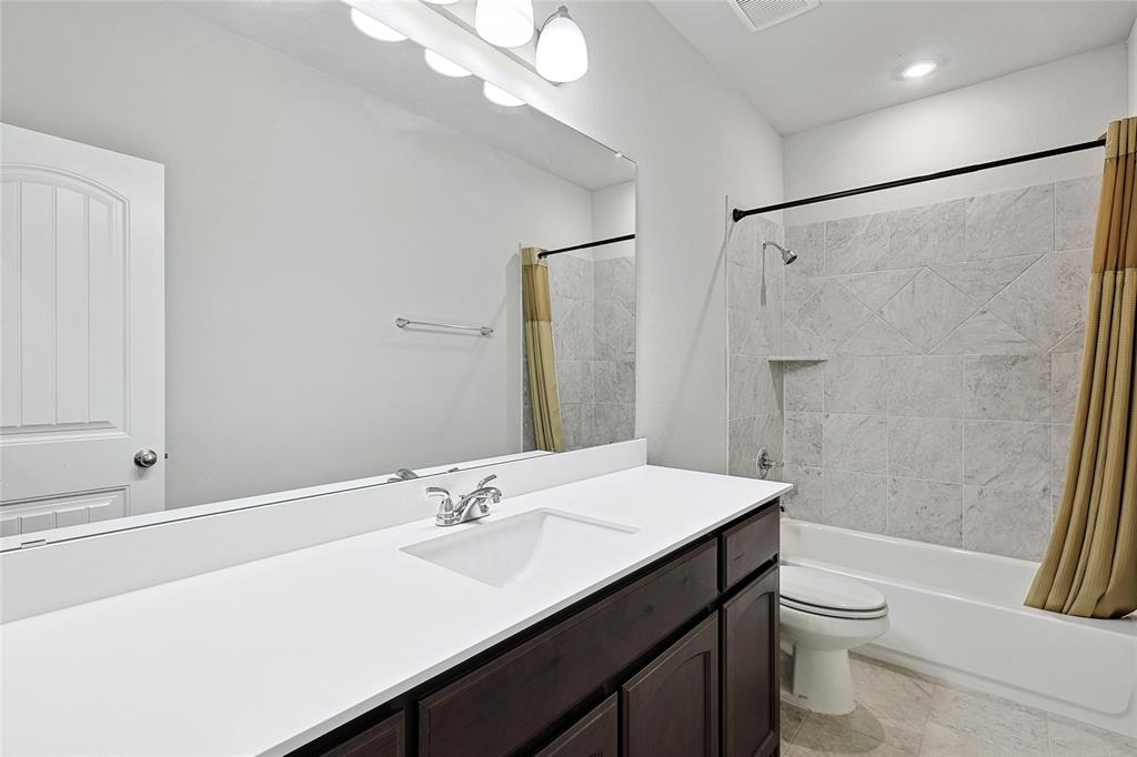 808 Feather Edge Drive Springtown, TX 76082 - Photo 32 of 40 a bathroom with a sink a toilet and shower