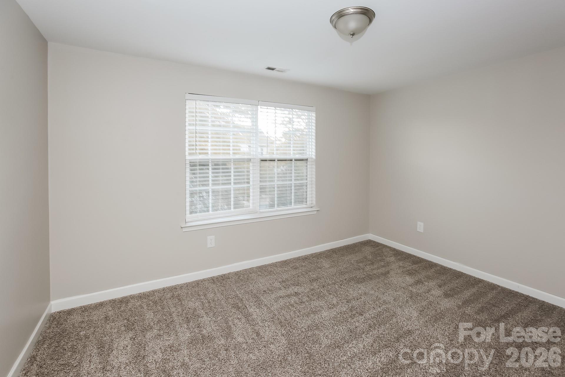 8812 Cornwall Street Locust, NC 28097 - Photo 12 of 15 an empty room with windows