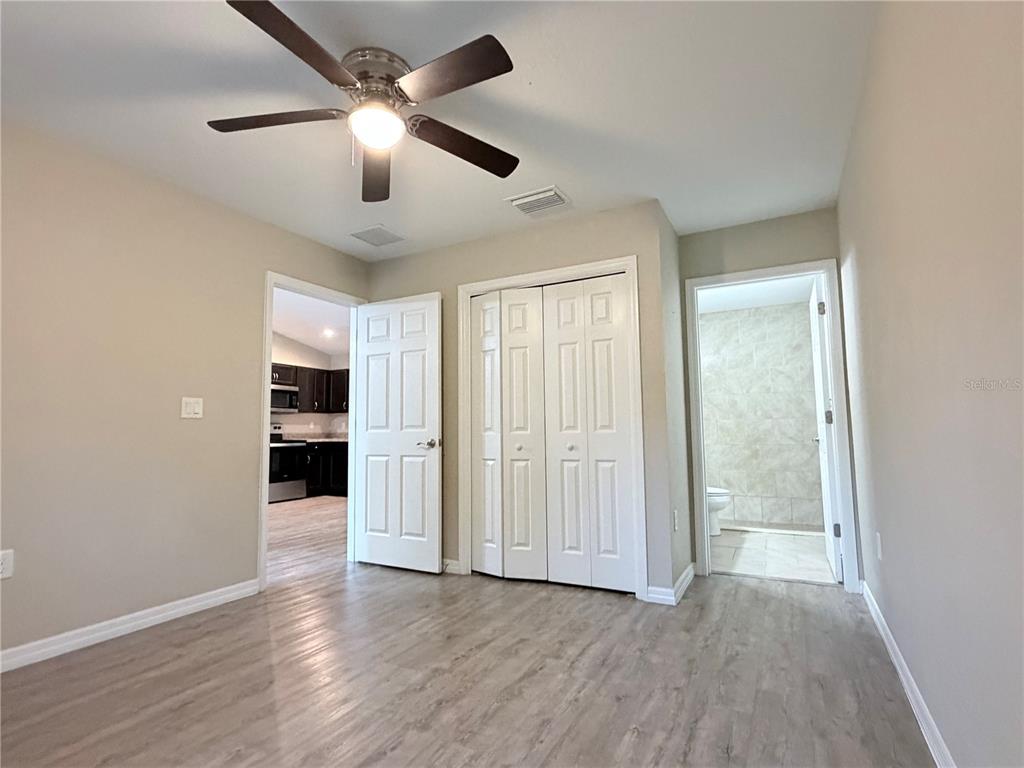 14445 Southwest 22nd Place Ocala, FL 34481 - Photo 6 of 11 wooden floor in an empty room with a window